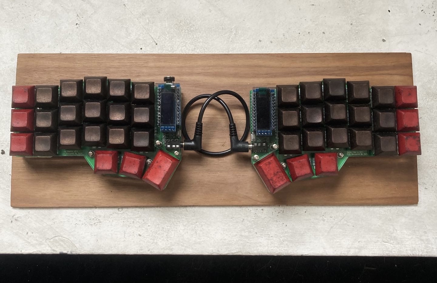 Bronze and red keycaps on a crkbd split ergonomic keyboard.